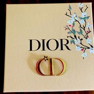 Dior lapel brooch.